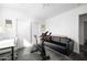 Bright exercise room features sleek floors, workout bike, modern lighting, and convenient sliding door access at 14025 N 11Th Pl, Phoenix, AZ 85022