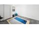 Versatile flex space features sleek floors, neutral colors, and can be used as an exercise or yoga room at 14025 N 11Th Pl, Phoenix, AZ 85022