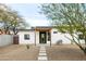 Charming single-story home with desert landscaping and a green front door at 14025 N 11Th Pl, Phoenix, AZ 85022