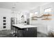 Bright, modern kitchen with stainless steel appliances, a large island, and white cabinetry at 14025 N 11Th Pl, Phoenix, AZ 85022