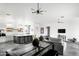 Spacious living room boasts concrete floors, modern light fixtures, a large island with seating, and an open floor plan at 14025 N 11Th Pl, Phoenix, AZ 85022