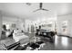 Bright and airy living room showcasing modern furniture, gray concrete floors and an open layout to the kitchen at 14025 N 11Th Pl, Phoenix, AZ 85022