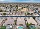 Wide aerial shot showcasing homes, landscaping, and neighborhood streets, displaying a peaceful residential area at 14474 W Lexington Ave, Goodyear, AZ 85395