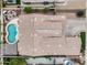 Aerial view of a home featuring a pool, seating area, and well-maintained landscaping, perfect for outdoor relaxation at 14474 W Lexington Ave, Goodyear, AZ 85395