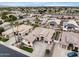 Elevated aerial view of neighborhood, with well-kept landscaping, mature trees, and convenient access to local amenities at 14474 W Lexington Ave, Goodyear, AZ 85395