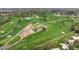 Expansive aerial view of a lush golf course with manicured greens and mature trees at 14474 W Lexington Ave, Goodyear, AZ 85395