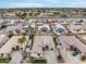 Aerial view of a neighborhood showcasing well-maintained homes, solar panels, and community layout, close to city services at 14474 W Lexington Ave, Goodyear, AZ 85395