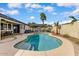 Backyard pool with outdoor kitchen, pergola, and dining area at 14474 W Lexington Ave, Goodyear, AZ 85395