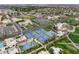 Aerial view of tennis courts with surrounding landscaping, integrated in a resort or large community at 14474 W Lexington Ave, Goodyear, AZ 85395