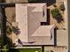 An aerial view of a neutral-toned single-Gathering house and backyard at 1455 W Posada Ave, Mesa, AZ 85202