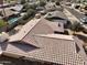 Aerial view of a residential house with a neutral toned tile roof at 1455 W Posada Ave, Mesa, AZ 85202