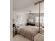 Comfortable bedroom with neutral decor, plush bedding, and a ceiling fan at 1455 W Posada Ave, Mesa, AZ 85202