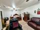 The bedroom includes a comfortable seating area, carpet flooring, and natural light at 1455 W Posada Ave, Mesa, AZ 85202