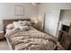 Bedroom with rustic accents, cozy textures, and modern lighting fixtures at 1455 W Posada Ave, Mesa, AZ 85202