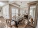Charming dining room with a rustic table, modern chandelier, and stylish decor at 1455 W Posada Ave, Mesa, AZ 85202