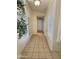 Hallway with tile flooring, white walls, and shuttered windows at 1455 W Posada Ave, Mesa, AZ 85202