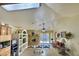 Spacious living room with a fireplace, built-in shelving, and access to the backyard through sliding doors at 1455 W Posada Ave, Mesa, AZ 85202