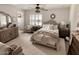 Cozy main bedroom featuring a neutral color palette, soft textures, and plenty of natural light at 1455 W Posada Ave, Mesa, AZ 85202