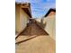Gated side yard with neutral color fencing at 1455 W Posada Ave, Mesa, AZ 85202