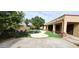 Backyard oasis with a sparkling pool, waterfall feature, and lush landscaping at 1544 N Rico Cir, Mesa, AZ 85213