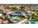 A bird's eye view shows the home's backyard oasis with pool, patio, playground and solar panels at 15802 N 50Th Dr, Glendale, AZ 85306