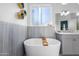 Bathroom featuring bathtub with shelving at 15802 N 50Th Dr, Glendale, AZ 85306