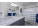 Bright bathroom with dual sinks, granite countertop, and modern fixtures at 15802 N 50Th Dr, Glendale, AZ 85306