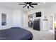 Bedroom featuring plush carpet, ceiling fan, and gray color scheme at 15802 N 50Th Dr, Glendale, AZ 85306