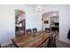 Dining room featuring rustic wood table and modern chandelier at 15802 N 50Th Dr, Glendale, AZ 85306
