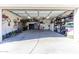Spacious three car garage featuring ample storage, a safe, and organization systems at 15802 N 50Th Dr, Glendale, AZ 85306