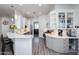 Kitchen area featuring modern appliances, large island with breakfast bar, and decorative glassware at 15802 N 50Th Dr, Glendale, AZ 85306