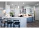 Bright eat-in kitchen with stainless steel appliances, large pantry, and pendant lights at 15802 N 50Th Dr, Glendale, AZ 85306