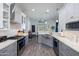 Bright kitchen with stainless steel appliances, subway tile backsplash, and gray cabinets at 15802 N 50Th Dr, Glendale, AZ 85306