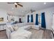 Bright and airy living room featuring modern furniture, ceiling fans, and backyard views at 15802 N 50Th Dr, Glendale, AZ 85306