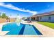 Inviting backyard featuring a pristine pool, playset, and lounge area, perfect for outdoor entertainment at 15802 N 50Th Dr, Glendale, AZ 85306