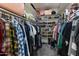 Spacious walk-in closet with rods and shelving perfect for organizing clothes, shoes, and accessories at 15802 N 50Th Dr, Glendale, AZ 85306