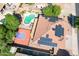 Aerial view of home with swimming pool, basketball court and solar panels at 16626 W Baden Ave, Goodyear, AZ 85338