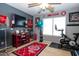 Bedroom featuring exercise equipment, a ceiling fan, and natural light from the windows at 16626 W Baden Ave, Goodyear, AZ 85338