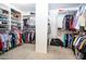 Spacious walk-in closet with organized shelving and ample storage space for clothing and shoes at 16626 W Baden Ave, Goodyear, AZ 85338