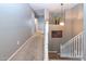 Upstairs hallway with carpet flooring, white trim, and gray walls at 16626 W Baden Ave, Goodyear, AZ 85338
