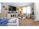 Well-lit living room features modern decor, bright light, neutral tones and comfortable seating area at 16626 W Baden Ave, Goodyear, AZ 85338