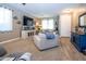 Comfortable living room with neutral colors, bright light, modern decor and tile flooring at 16626 W Baden Ave, Goodyear, AZ 85338