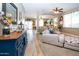 Open-concept living room with neutral colors, bright light, comfortable seating and a view to a large patio at 16626 W Baden Ave, Goodyear, AZ 85338