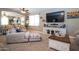 Well-lit living room features modern decor, bright light, neutral tones and comfortable seating area at 16626 W Baden Ave, Goodyear, AZ 85338