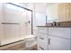 Clean bathroom with a white vanity, shower, and toilet at 16868 W Earll Dr, Goodyear, AZ 85395