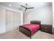 Serene bedroom with a ceiling fan and plenty of natural light at 16868 W Earll Dr, Goodyear, AZ 85395
