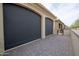 Covered outdoor area with privacy screens and brick flooring, offering a secluded retreat at 16868 W Earll Dr, Goodyear, AZ 85395