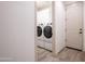 Practical laundry room equipped with modern washer and dryer at 16868 W Earll Dr, Goodyear, AZ 85395