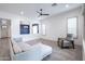 A spacious living area is well-lit with wood-look tile and a comfortable seating arrangement at 16868 W Earll Dr, Goodyear, AZ 85395