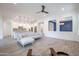 Open-concept living area with tile floors showcasing a view to the kitchen with stainless appliances at 16868 W Earll Dr, Goodyear, AZ 85395